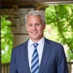 Joe Aluise standing in the lobby of Bloom Law.